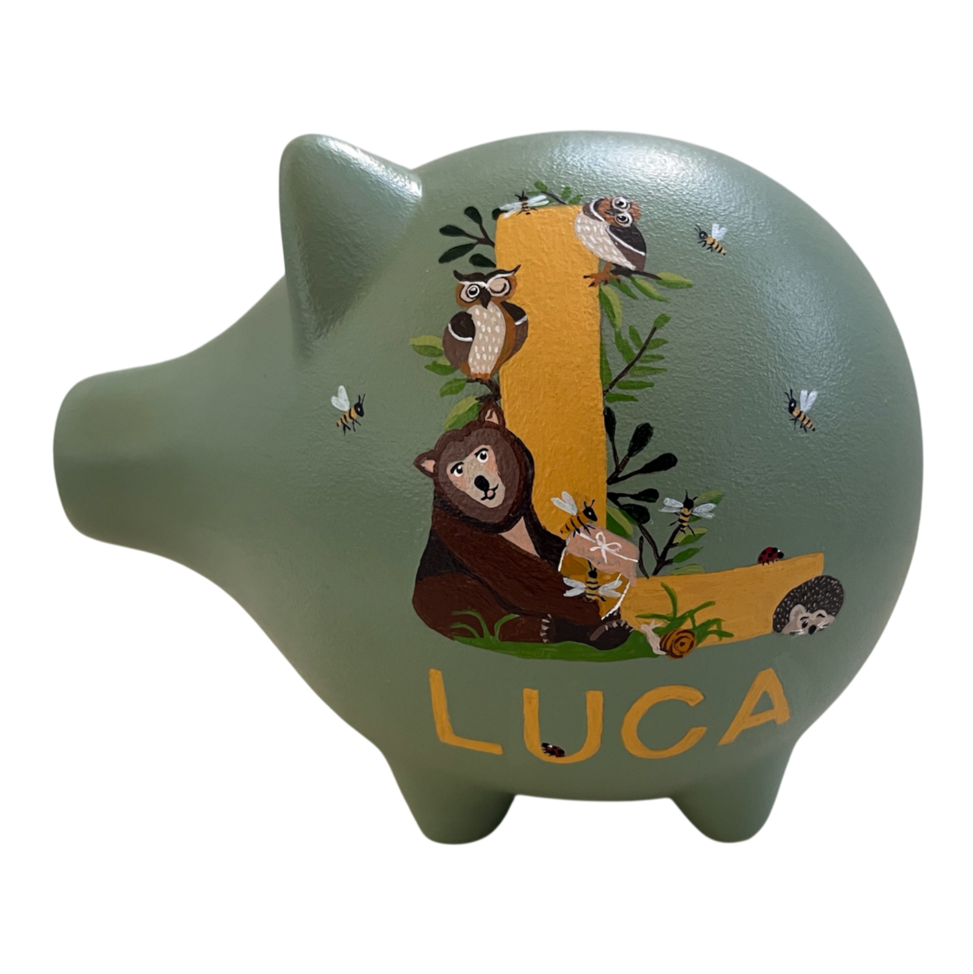 Spaarvarken met hoofdletter L en met dierenillustraties zoals beer en uilen, naam Luca.